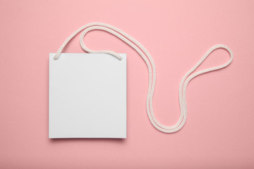 Business conference badge, name tag on pink background.