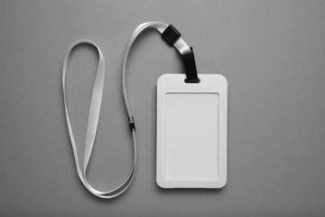 Clip pass, identification tag on grey background. Copy space.