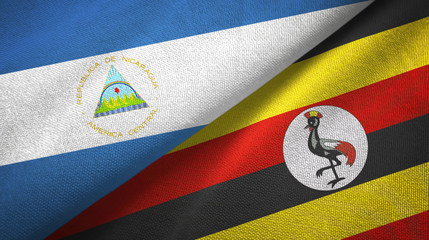 Nicaragua and Uganda two flags textile cloth, fabric texture