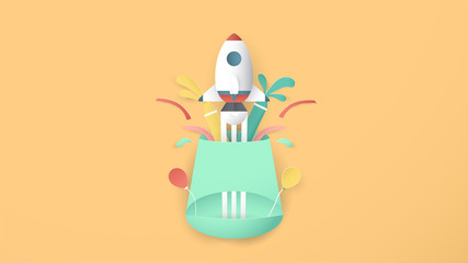 Vector illustration with start up concept in paper cut, craft and origami style. Rocket is flying. Template design for web banner, poster, cover, advertisement. It's art craft for kids.