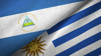 Nicaragua and Uruguay two flags textile cloth, fabric texture