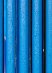 Many old blue pipes. Pipeline used in different industry ways: gas, water or vapor supply. Close up