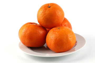 Orange in white plate on white background