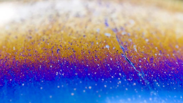 Abstract creative soap bubbles color texture.  4k close up macro of ink color in liquid water. 