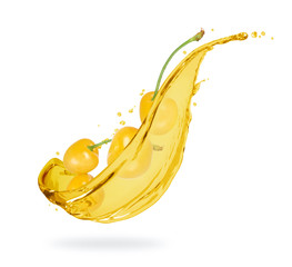 Yellow cherries with splashes of fresh juice close-up on white background