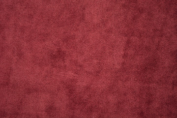 Red textile material velvet abstract textured background. Copy space