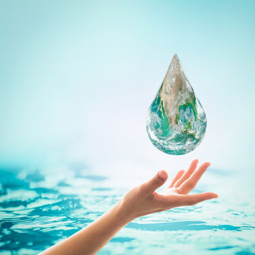 World ocean day,, saving water campaign, sustainable ecological ecosystems concept with green earth on woman's hands on blue sea background : Element of this image furnished by NASA .