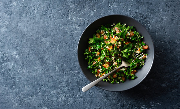 Healthy summer tabule salad bowl top view copy space