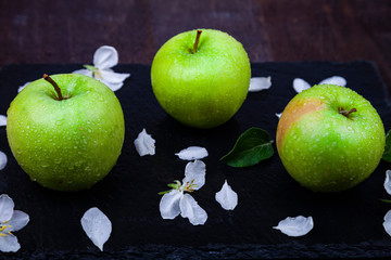 Green apples, flowers and leaves