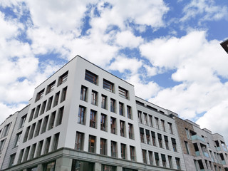 modern building with blue sky and clouds
