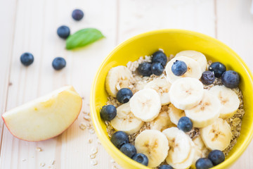 ood morning, great start to the day.  .Morning breakfast set with bowl of fruits apples and blueberry.