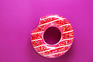 Obraz na płótnie Canvas Inflatable ring on color background