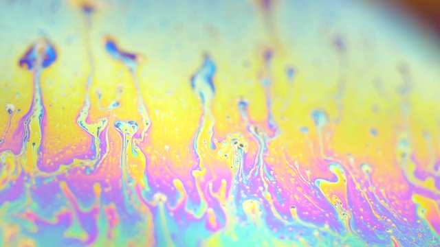 Abstract creative soap bubbles color texture.  4k close up macro of ink color in liquid water. 