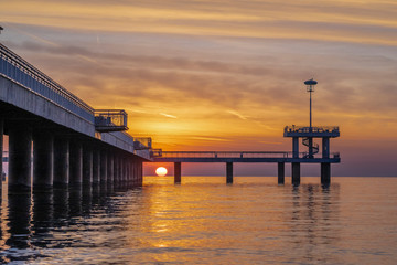 Fototapeta premium Red sunrise in Burgas on the bridge. Scenic sunrise. 