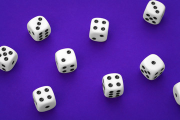 White dices against a blue background