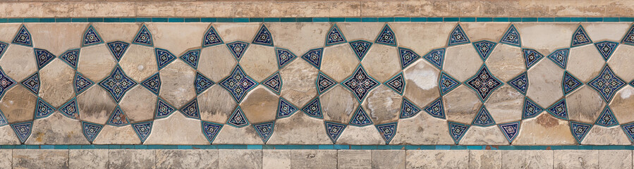 ancient wall of a mosque of mosaic tiles