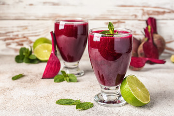 Glasses of fresh beet smoothie on table