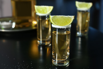 Shots of tequila on table in bar