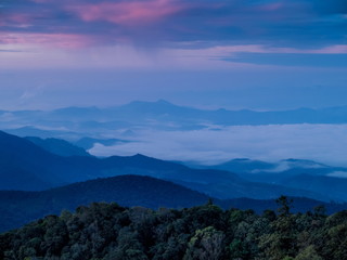 sunrise at Doi Inthanon, mountain view morning of the hills around with sea of fog with cloudy sky background, KM.41 View Point Doi Inthanon, Chiang Mai, Thailand.