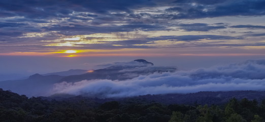 Panorama view sunrise at Doi Inthanon, mountain view morning of peak mountain Doi Hua Suea around with sea of fog with cloudy sky background, KM.41 view point Doi Inthanon, Chiang Mai, Thailand.