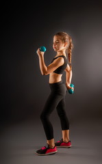 Fototapeta premium girl with dumbbells