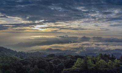 Panorama sunrise at Doi Inthanon, mountain view morning of the hills around with sea of fog with cloudy sky background, KM.41 View Point Doi Inthanon, Chiang Mai, Thailand.