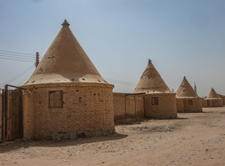 Round houses with conical pointed roofs, built by the English for the employees of the railways in...