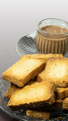 Crunchy Rusk or Toast with Cup of Tea in white background
