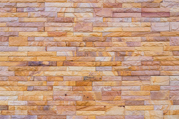 Modern stone brick wall background.