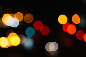 colorful lights in the street in the city at night, bokeh lights