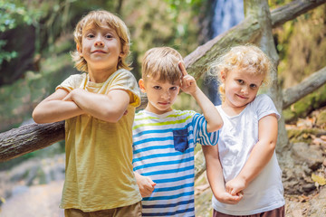 Fototapeta premium Children rest during a hike in the woods