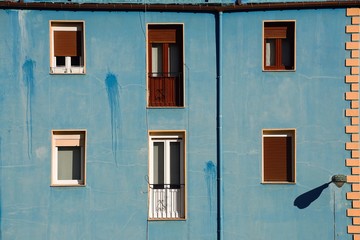 Fototapeta na wymiar window on the blue building facade in Bilbao city Spain, window in the street