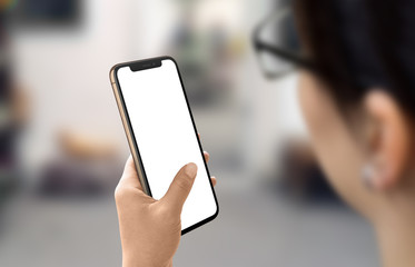 Modern smart phone in woman hand. Isolated screen for mockup. Using the phone in the business concept.