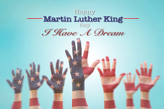 Happy Martin Luther King day, January 18th, I have a dream with American flag pattern on people hands raising up