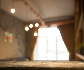 Empty wooden table in front of abstract blurred background of coffee shop . can be used for display or montage your products.Mock up for display of product