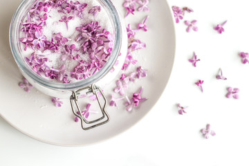 Obraz na płótnie Canvas Homemade preparing of lilac sugar with amazing fragrance
