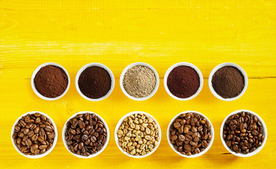 Assortment of roasted and raw coffee in bowls