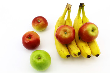 Bananas with apples on white background