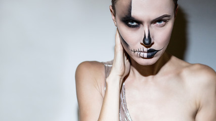 : Halloween Beautiful Woman Bright Black Halloween Makeup Isolated Gray Background