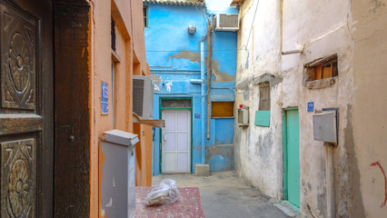 Alley and colorful traditional houses in Muharraq, Barhain