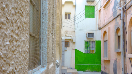 Alley and colorful traditional houses in Muharraq, Barhain