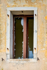 Broken window in an old home