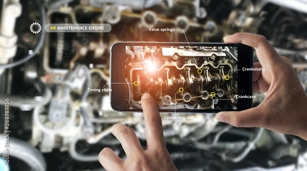 Poster Augmented reality concept. AR. Industrial 4.0 , Hand of engineer holding mobile smart phone using virtual AR to check the work of electric machine on smart factory background.