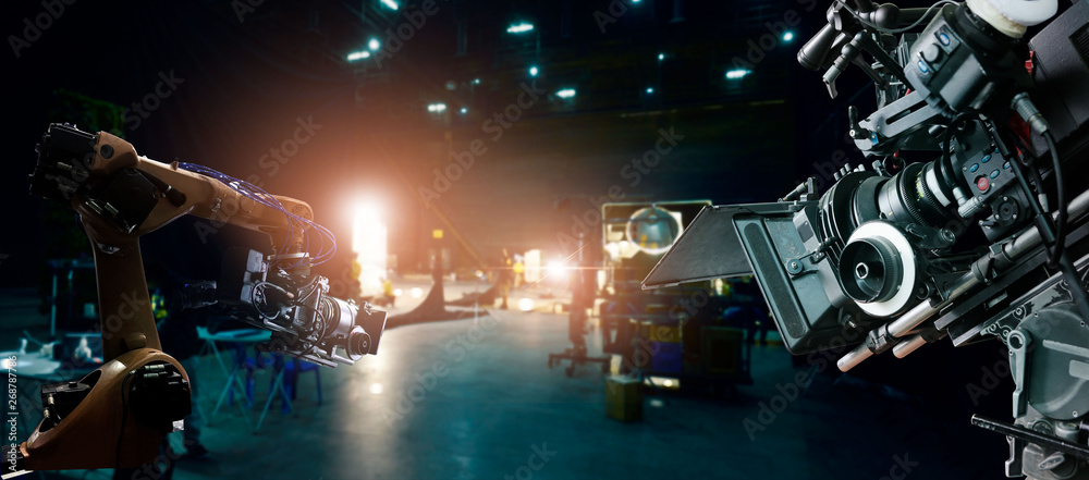 Poster Robotics automatic arms machine of making movie and TV commercial in studio. Camera of movie. Innovation and technology of movie industry with monitoring system software. Film crew team in set.