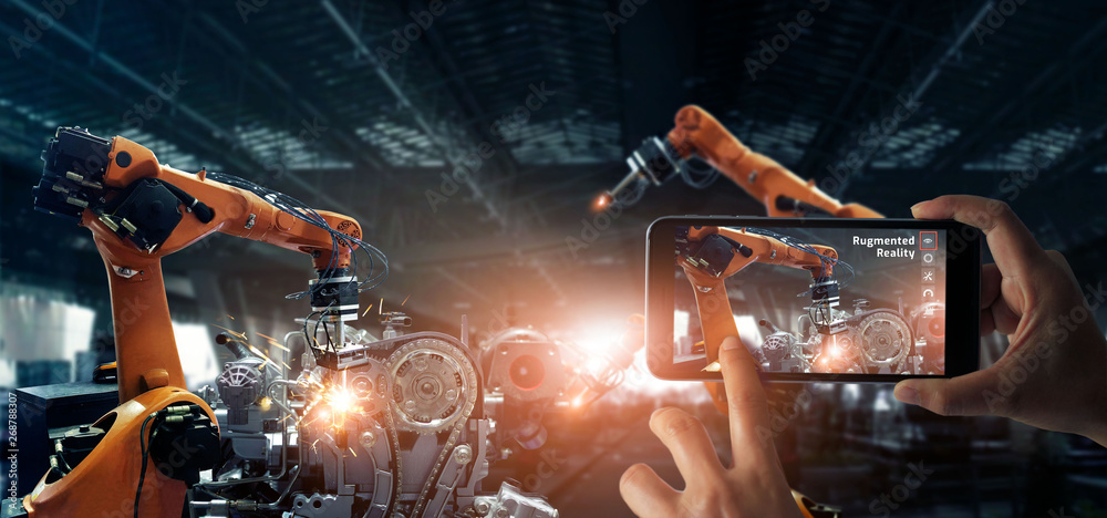Poster Augmented reality industry. Hand holding smartphone use AR application to check and control welding robotics automatic arms machine in factory automotive industrial with monitoring system software. 