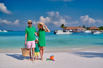 Family with three year old boy on beach