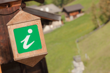 info point green wooden lantern in Val di Funes