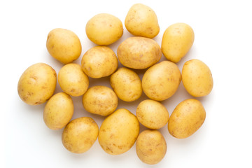 New potato and rosemarin isolated on white background close up.