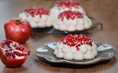 Pavlova cake with pomegranate. Meringue cake with pomegranate.