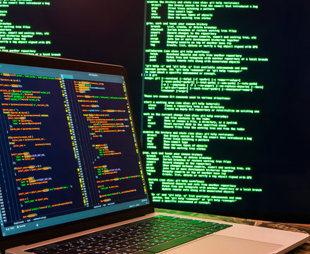 Hacker stealing password and identity, computer crime. Lots of digits on the computer screen